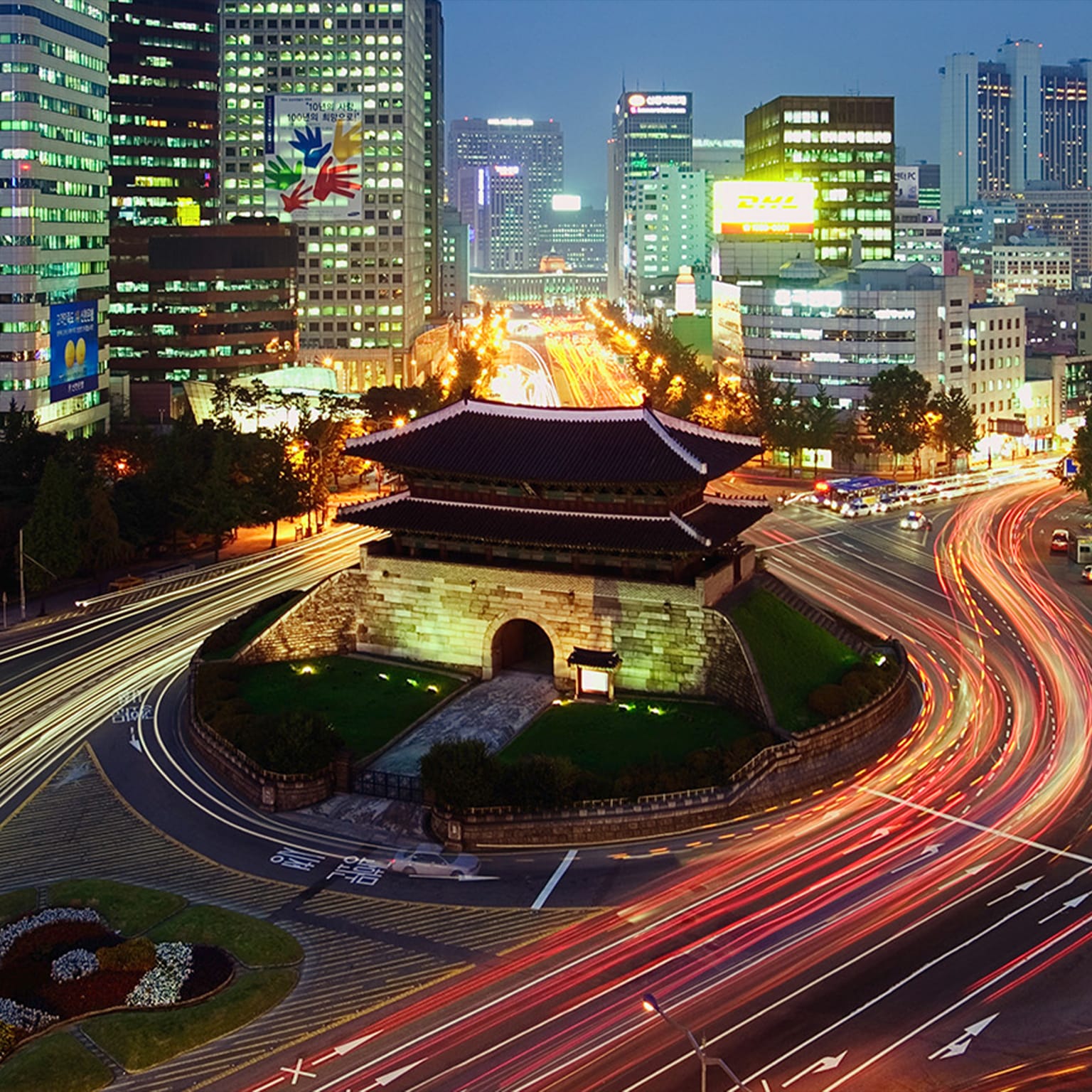 Elevated view of Namdaemun Gate and traffic at dusk in Seoul, South Korea. - stock photo