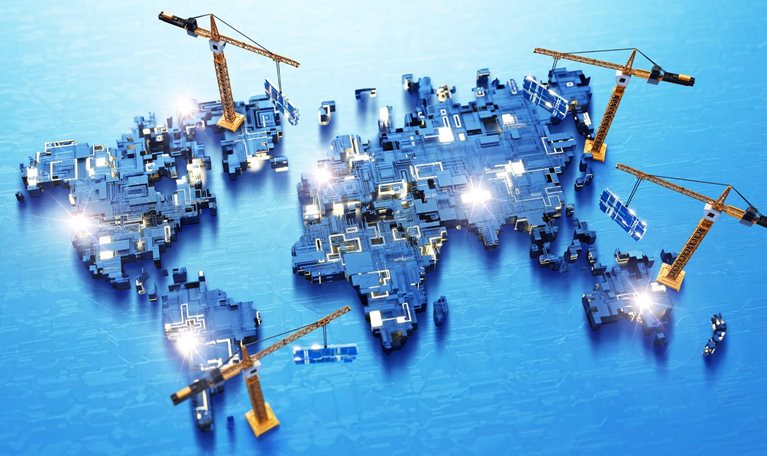A conceptual illustration of a world map built from interconnected circuit-board components, with several orange construction cranes appearing to assemble different regions. The image is accented by glowing circuitry and blue color palette.