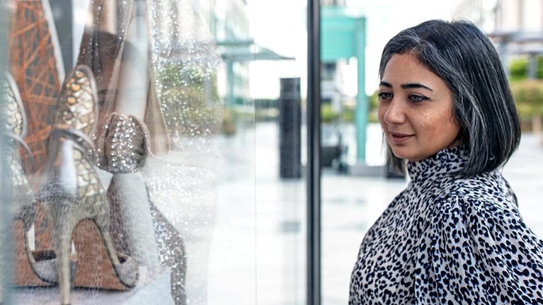 Middle Eastern woman window shopping