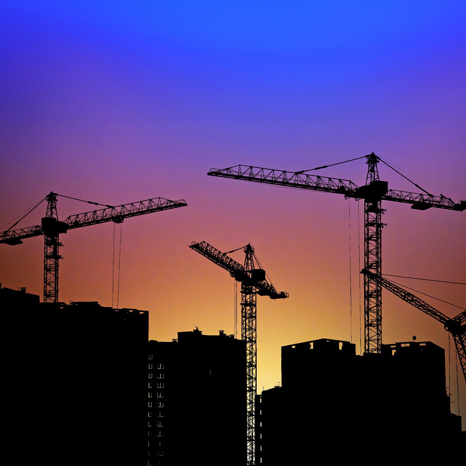 Silhouette of construction site crane
