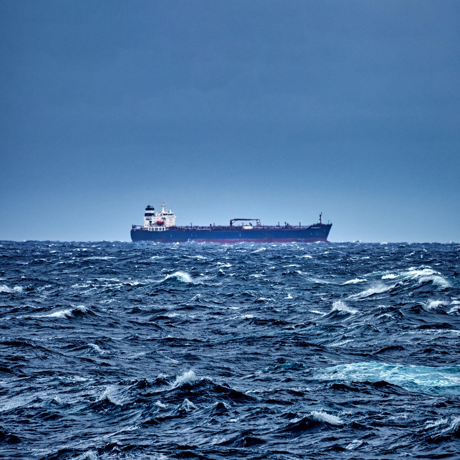 Ship delivering cargo in the stormy Mediterranean sea