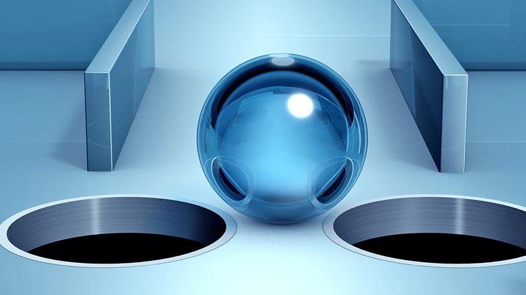 3D image of a glass sphere at a narrow spot in a maze, navigating between two dangerous holes.