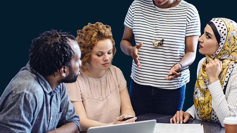 Diverse group of business people having discussion during meeting in office