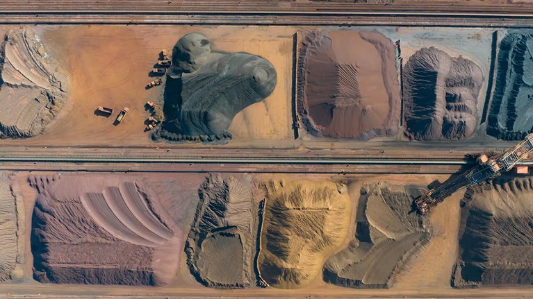 Aerial view of metal raw materials stacked at freight terminal