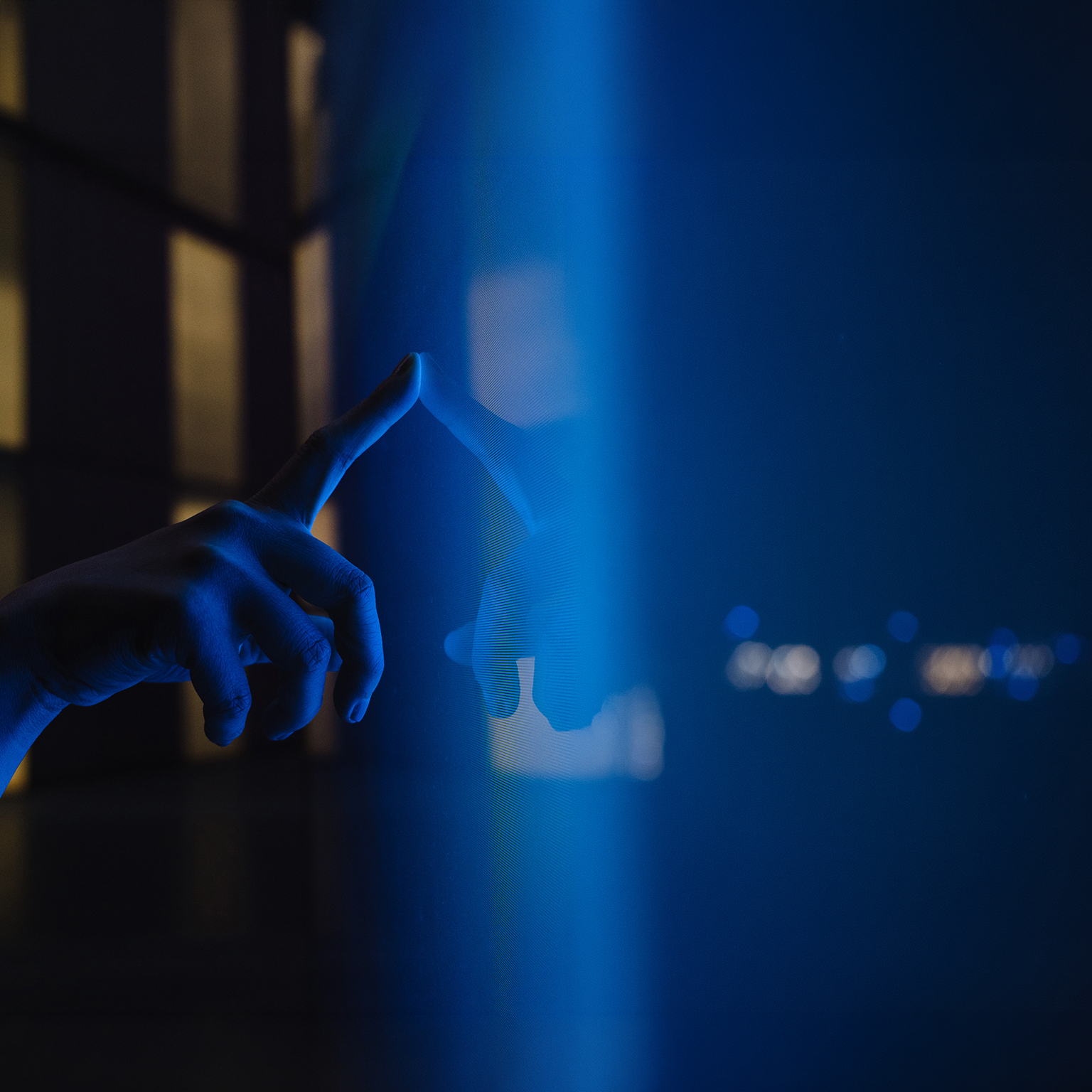 Close up view of woman hand using interactive touchscreen display of electronic kiosk