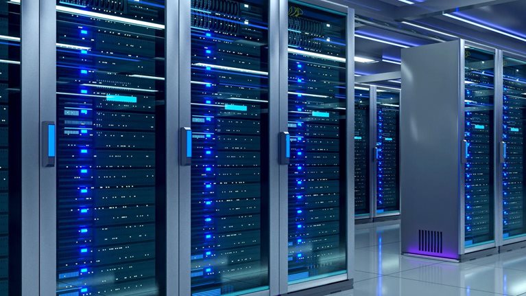 A modern data center filled with rows of illuminated server racks extending into the distance under bright blue lighting.
