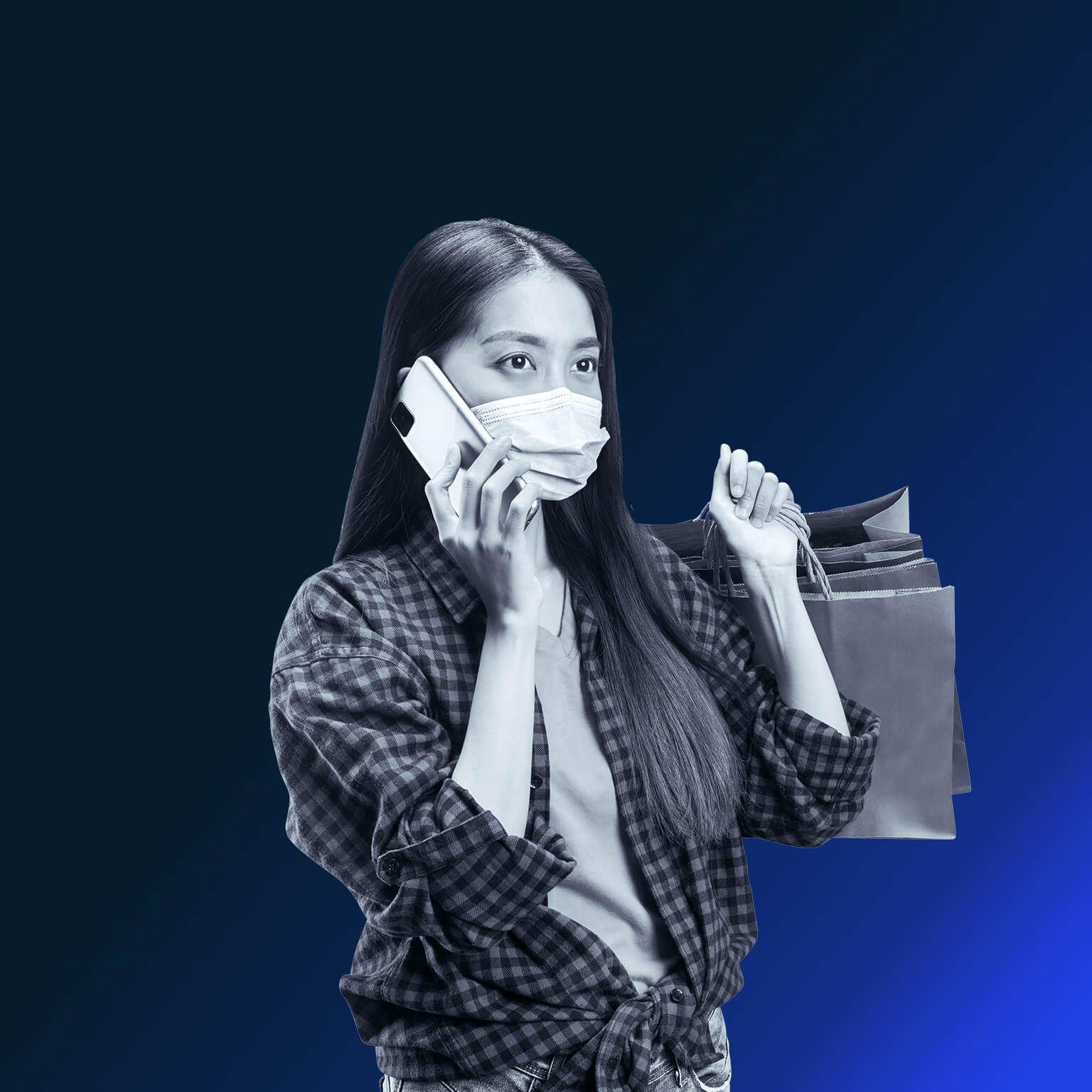 Asian woman with shopping bags and mask on mobile phone