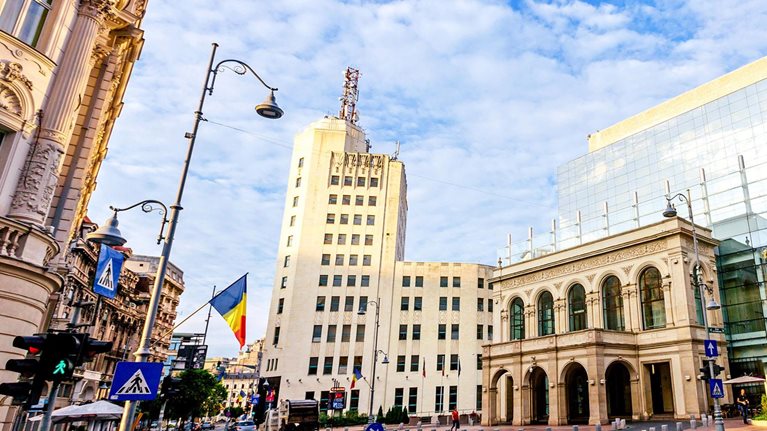 Modern and old buildings on Calea Victoriei Boulevard in Bucharest, Romania