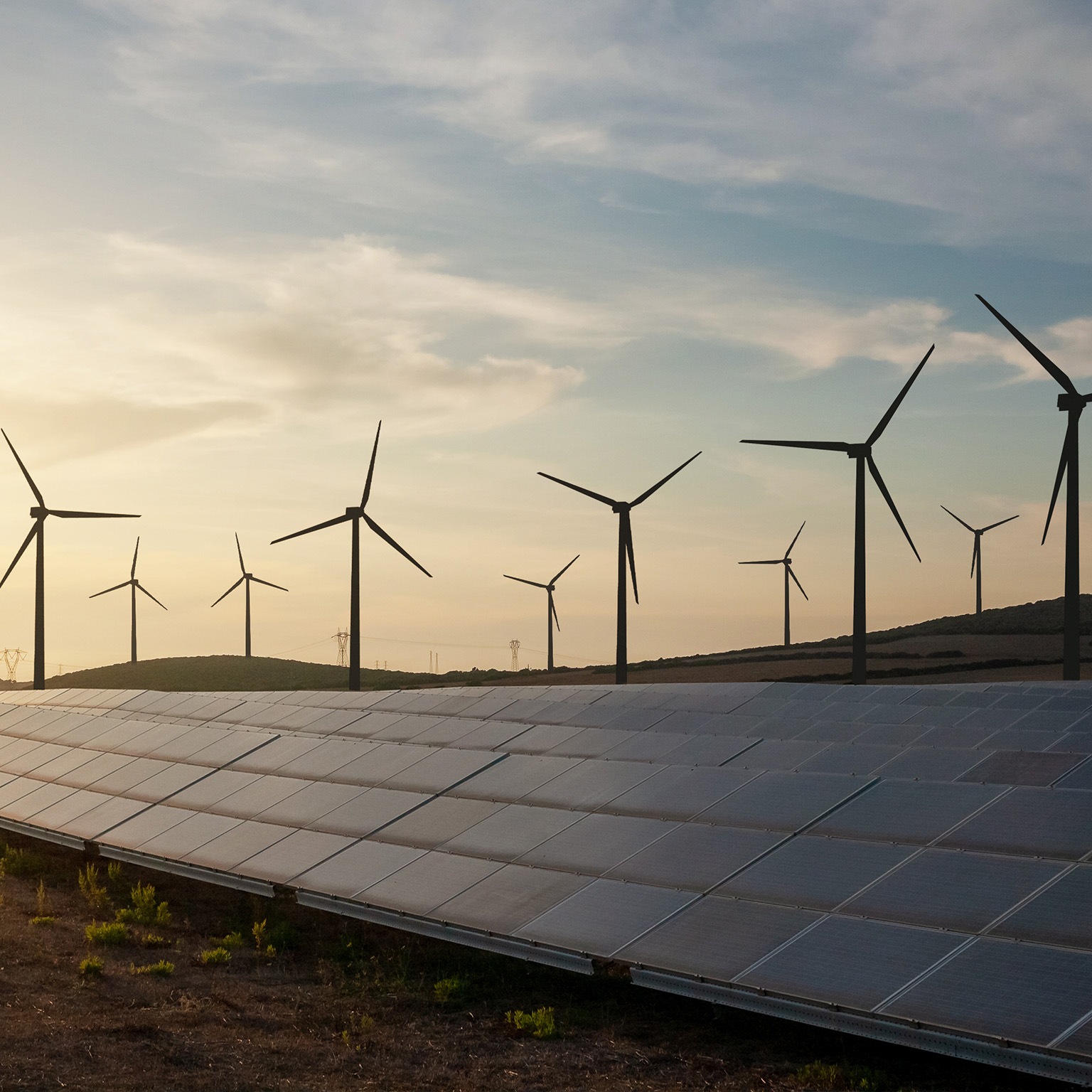 Solar and wind energy farm - stock photo
