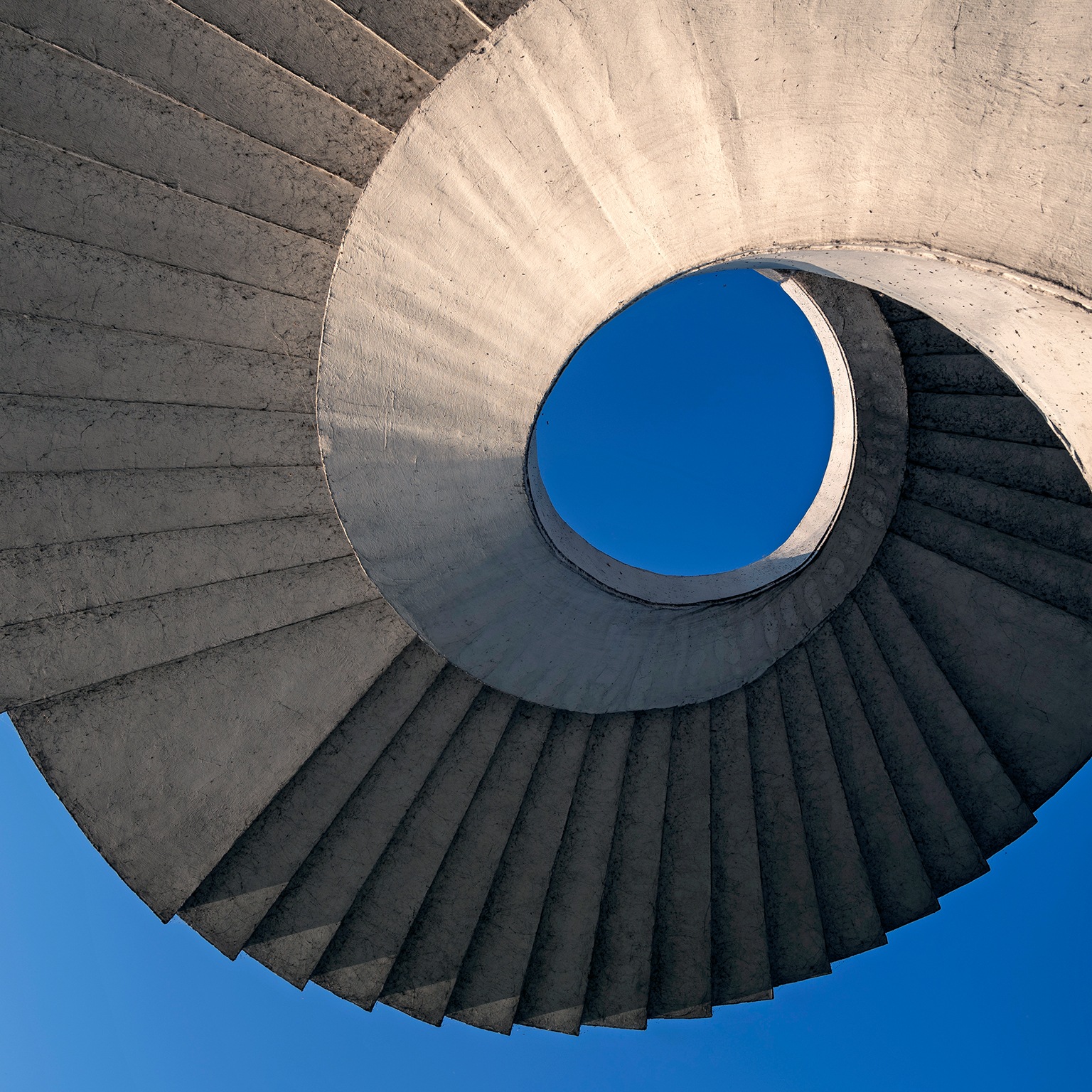  Abstract view of a circular concrete stairway under the Gdanski Bridge in Warsaw, Poland