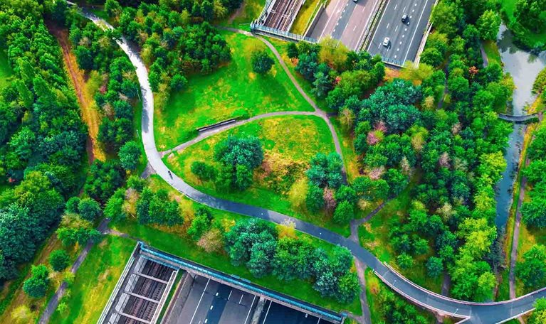 Photo of overview shot of a park with a highway