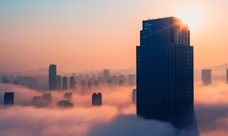 Aerial view of office building in cloud. - stock photo