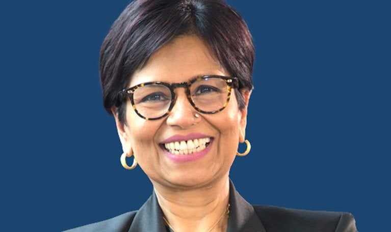 A smiling portrait of Amazon Web Services Managing Director, Tanuja Randery