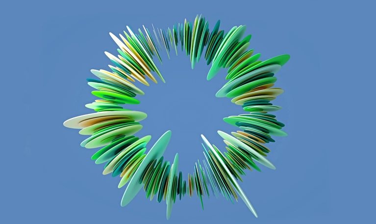 An abstract ring-like structure composed of many green, yellow, and blue layered, petal-shaped elements. It has a sense of depth and is set against a solid blue background.