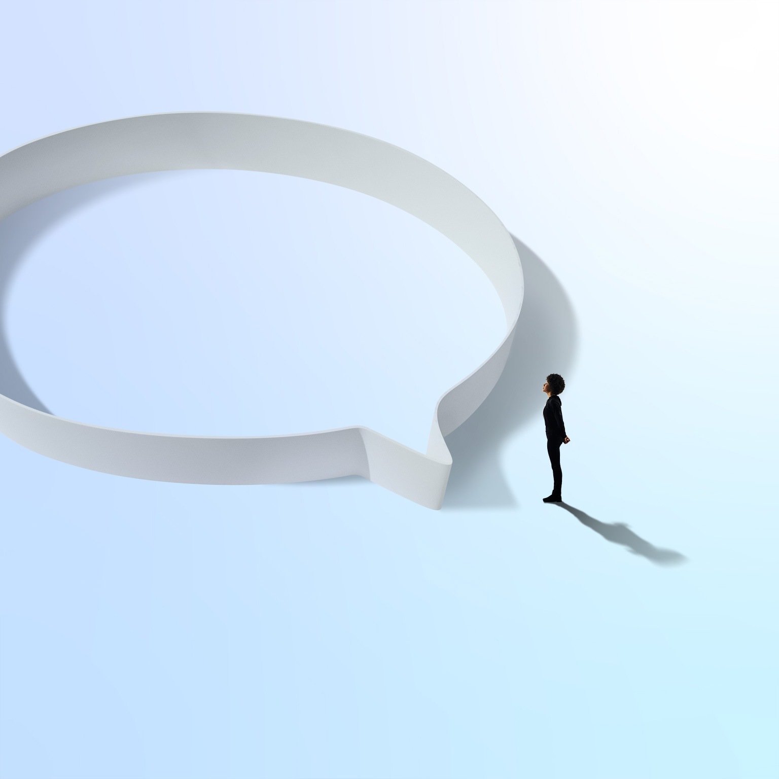 Woman in black standing near a circular hoop