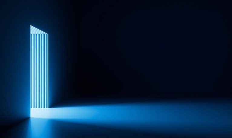 Bright light going through the door portal inside the empty dark room