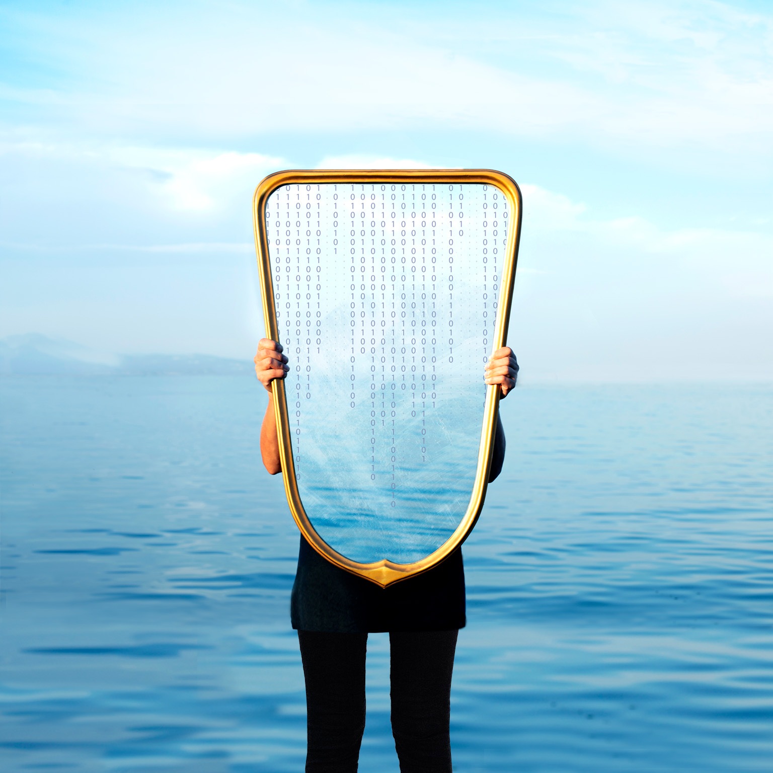 A woman stands at the ocean’s horizon, holding a mirror in front of her. It reflects the sky and a cascade of zeros and ones.