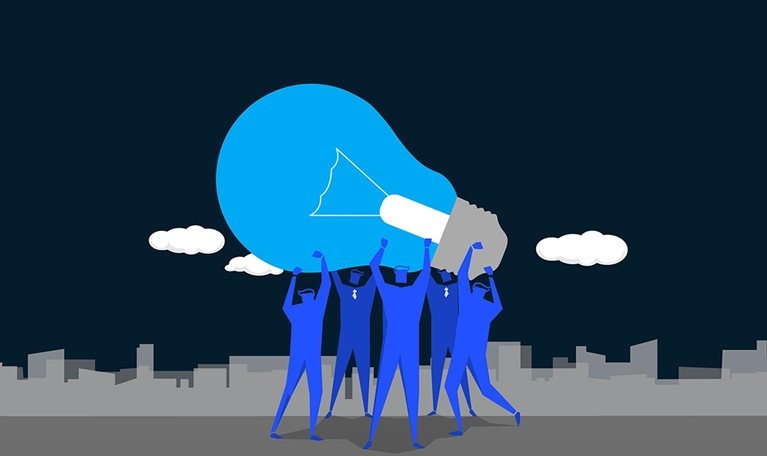 Illustration of several co-workers holding up and carrying lightbulb together.