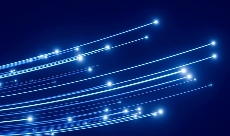 Abstract image of curved blue light trails with glowing points on a dark blue background.