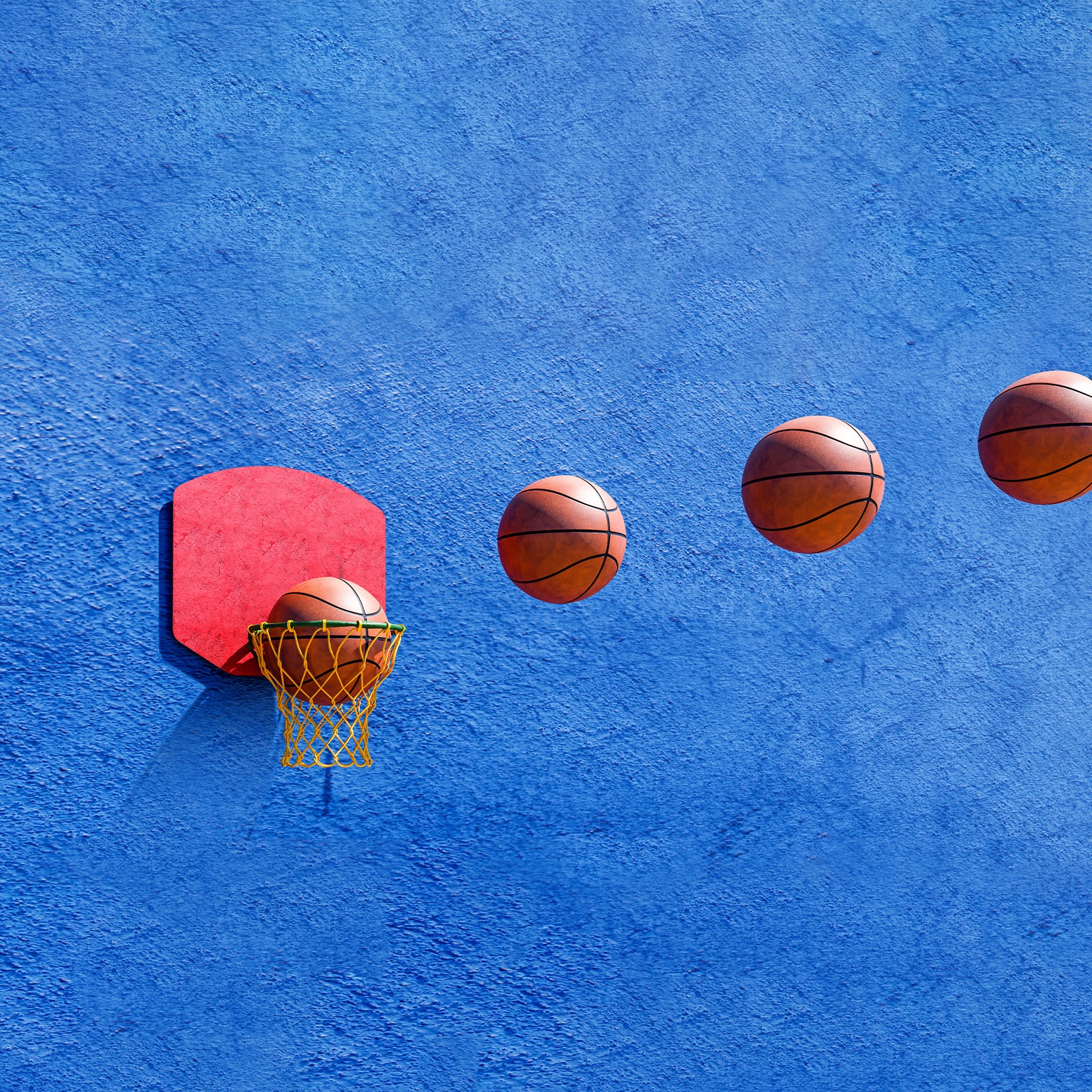 Image sequence of 4 basketballs flying through the air and going into a hoop.