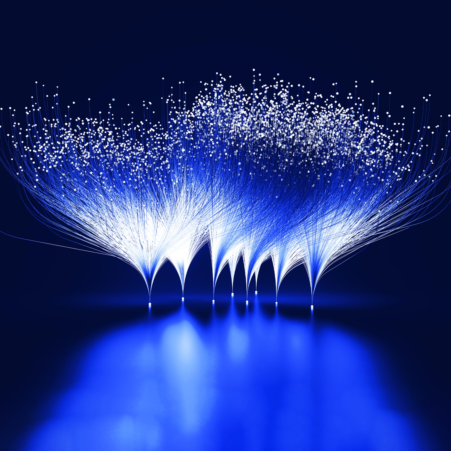 Abstract blue and white lines emanating from white dots against a dark blue background. This visual metaphor represents the branching-out and expansive growth facilitated by innovation.