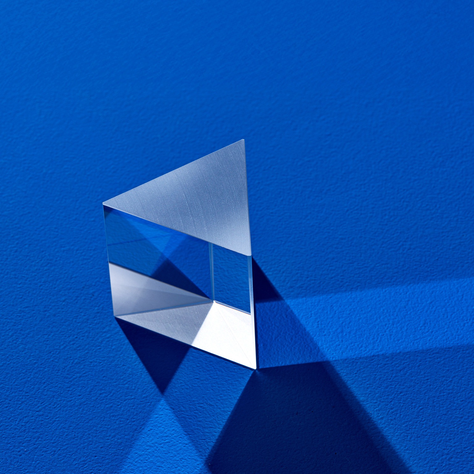 Triangular prism refracting light beam