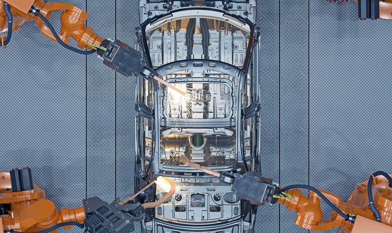 Digital generated image of robots welding a car body on production line