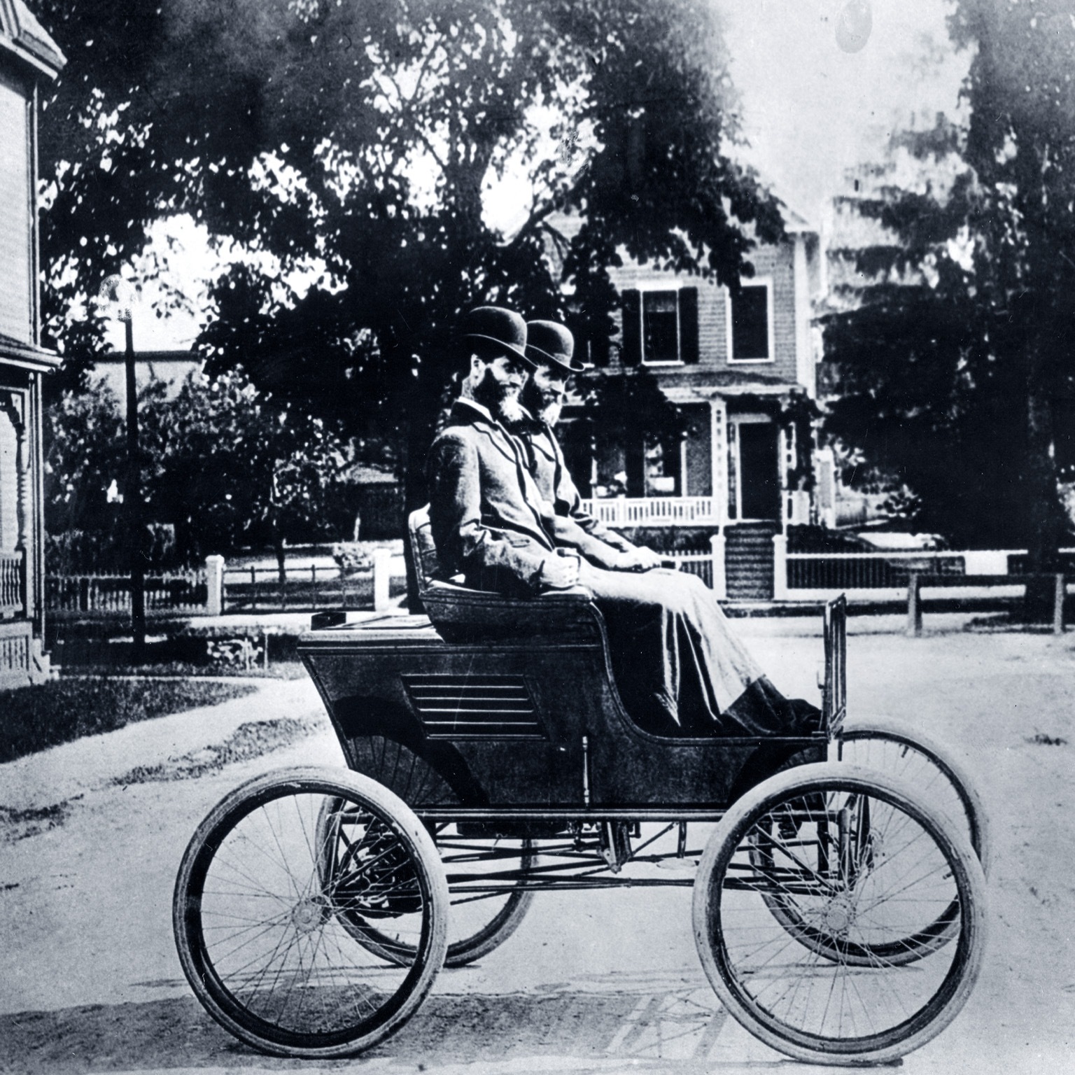 Portrait of twins and automobile manufacturers Freelan (1849-1940) and Francis Stanley (1849-1918) as they pose in their Stanley Steamer car, 1897.