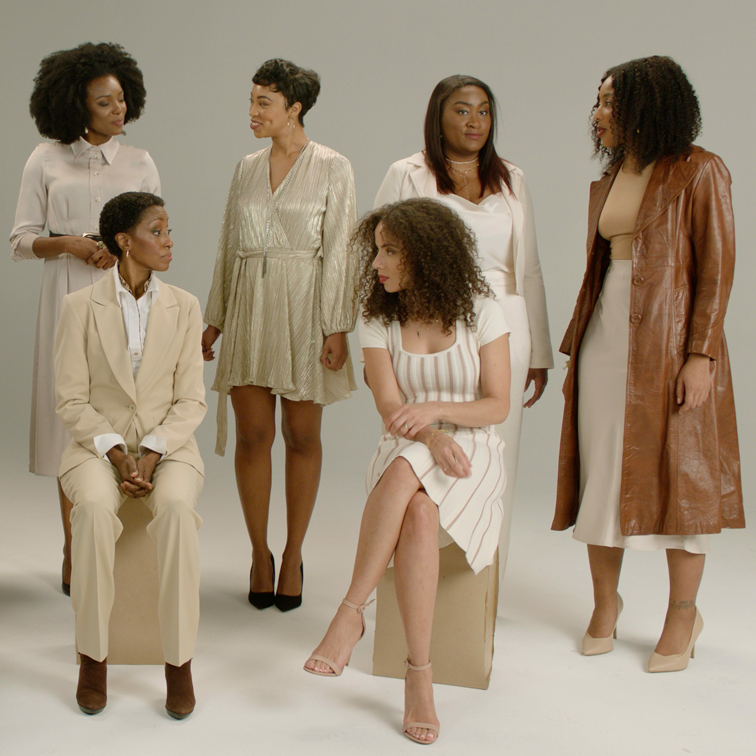 A group of six women conversing