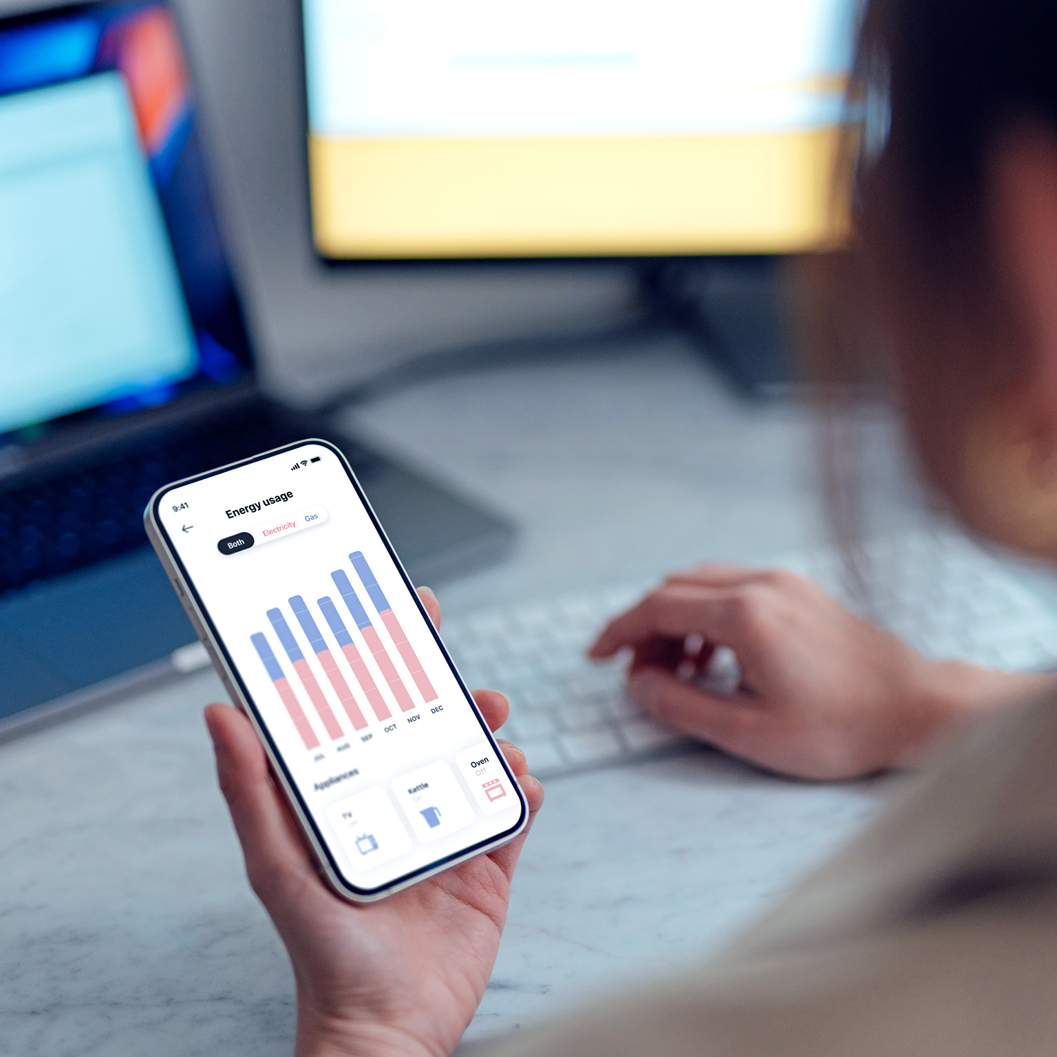 A young person pays the energy bill through an app on their phone
