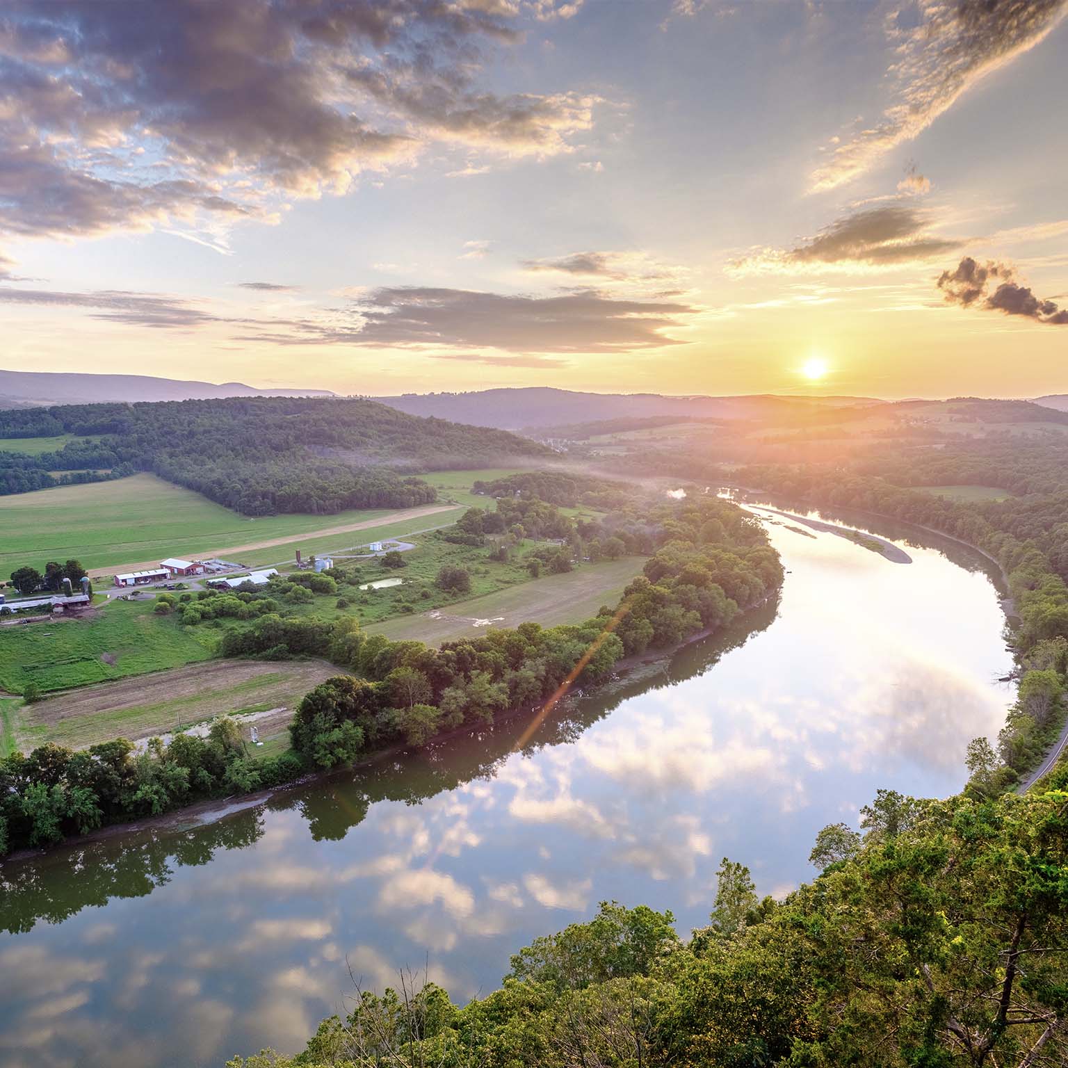 The sun sets over the Susquehanna River and the Terry Township's rolling farmland in northern Pennsylvania.