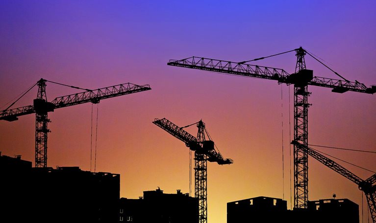 Silhouette of construction site crane