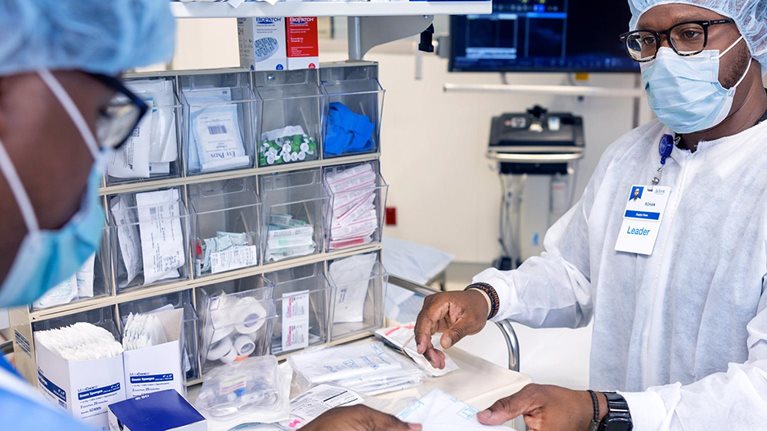 Healthcare professionals organizing medical supplies in clinical setting