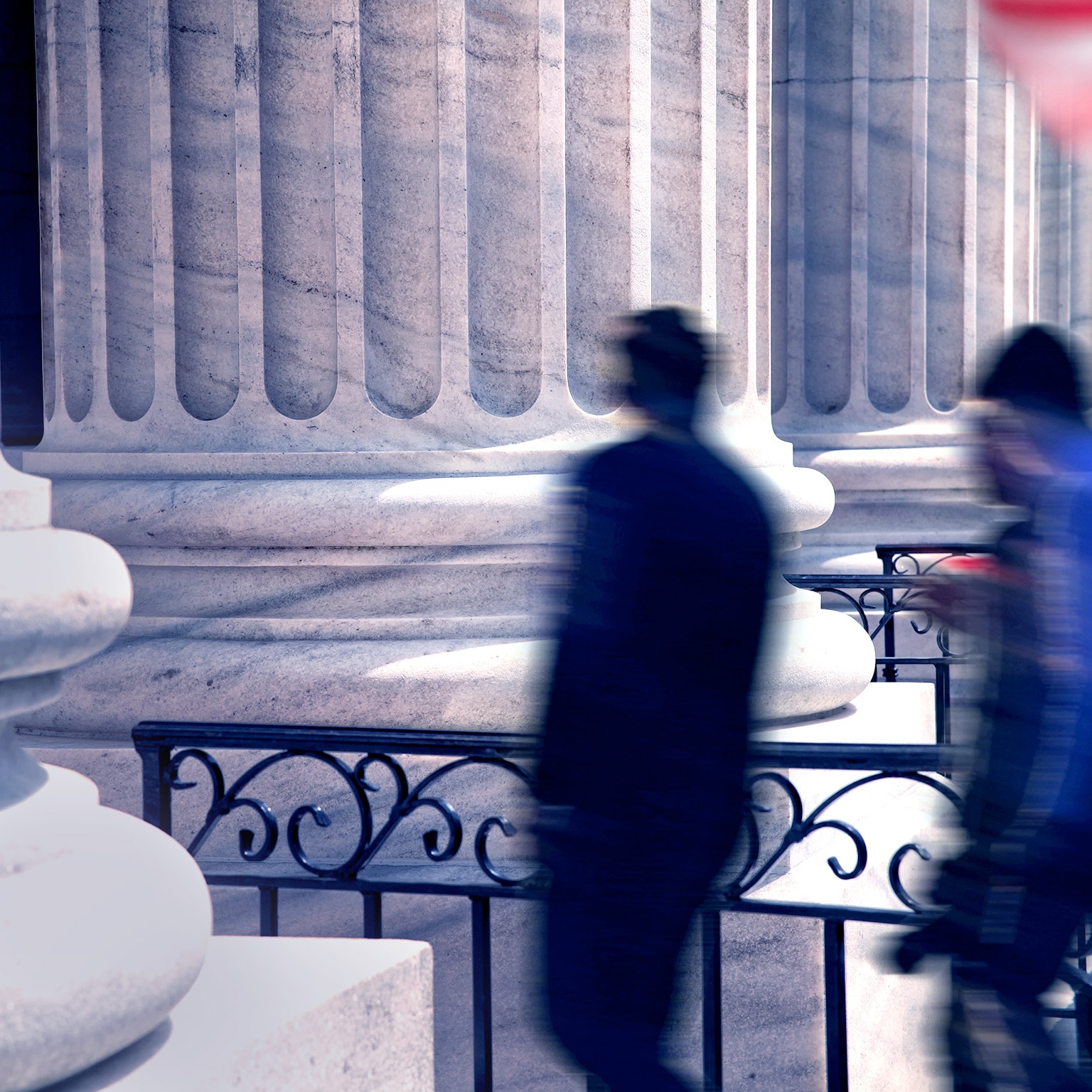 Blurred motion busy people and office building exterior - stock photo
