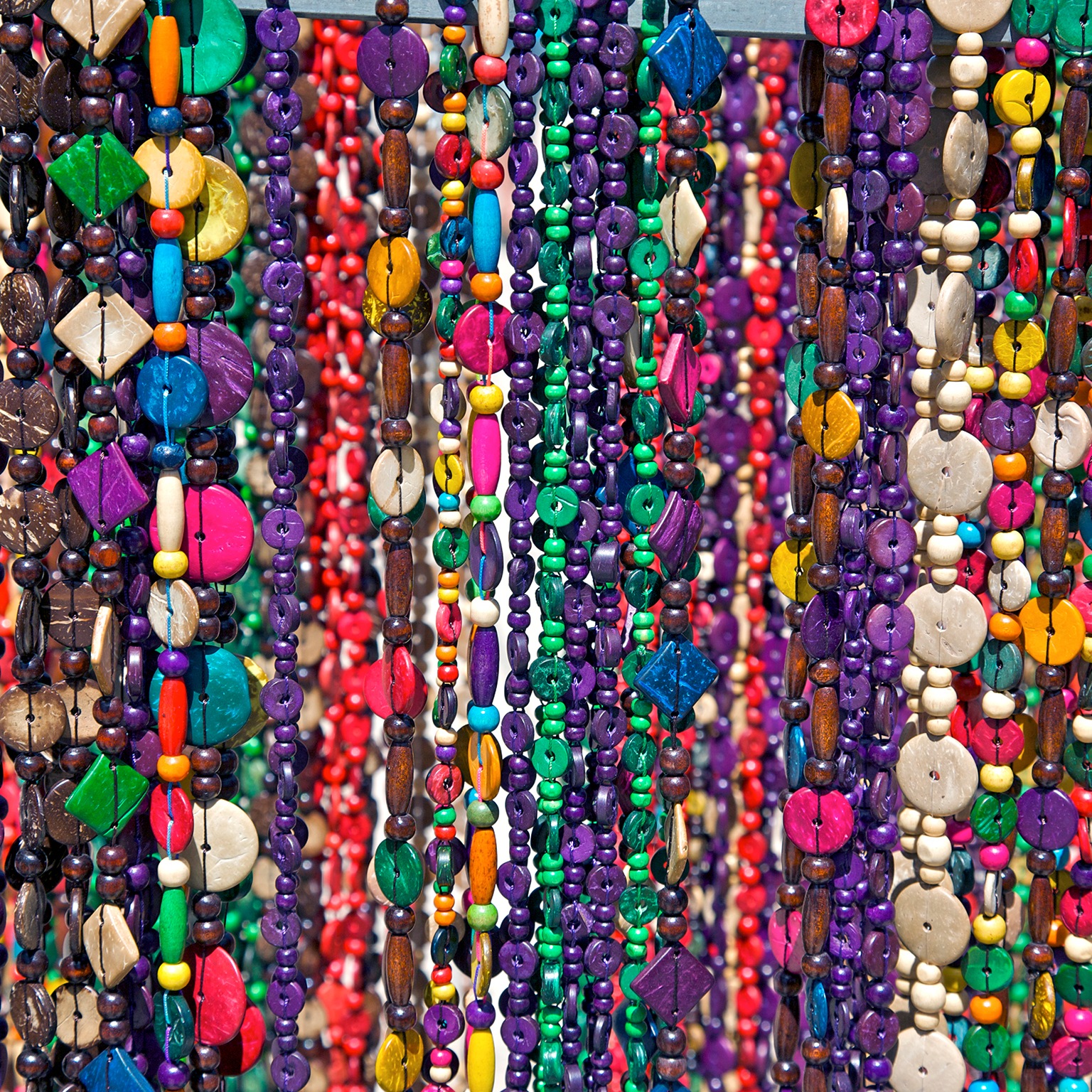 Strings of beaded necklaces for sale.