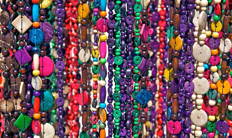 Strings of beaded necklaces for sale.