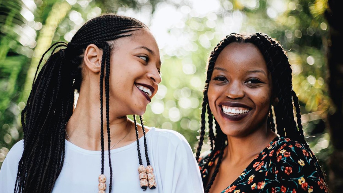 two people standing outside
