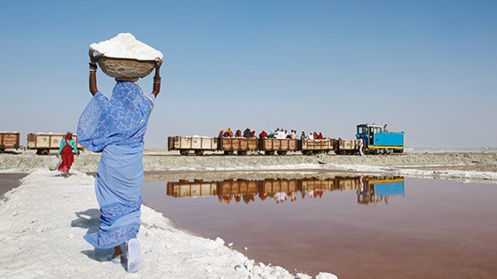 A photo of a woman farming salt in Rajasthan