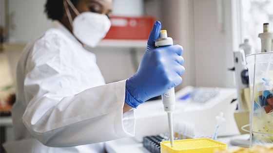 Photo of a person working in a lab