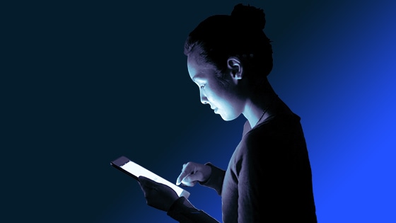 Photo of person using an computer tablet