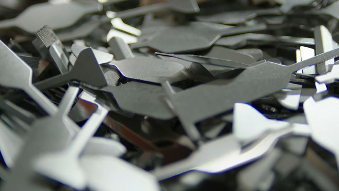 A variety of metal scrap pieces, representing different kinds of worker skills and competencies