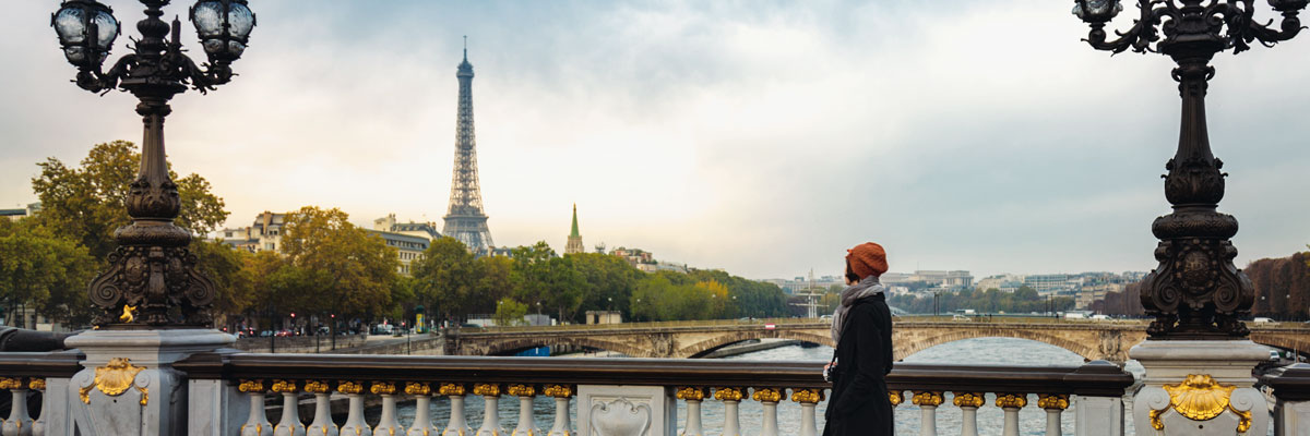 image of woman on a bridge in Paris