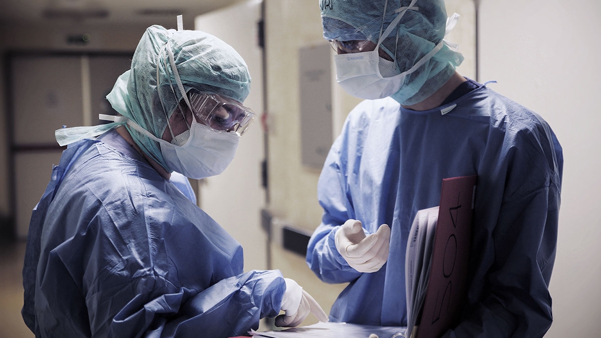 photo of two people in surgical gear
