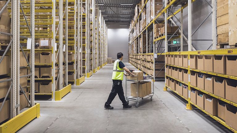 Image of a large worker in a warehouse