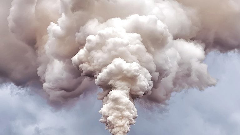 Image of a smokestack emitting pollution into the air