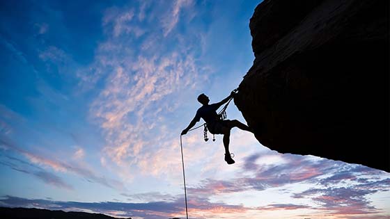 Image of a person rock climbing