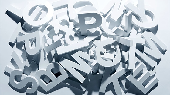 Image of various block letters stacked in a pile