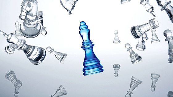 Image of a blue queen chess piece surrounded by various other chess pieces in gray