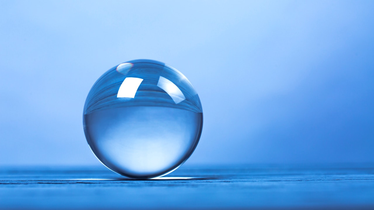 Image of a translucent blue sphere on a blue background