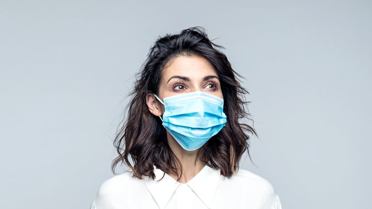 Image of a woman in a medical mask